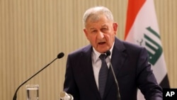 Iraqi president sues PM, finance minister over unpaid salaries
