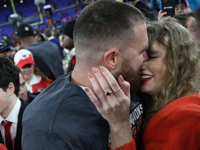 Taylor Swift and Travis Kelce were spotted sharing major PDA on the field after the Chiefs secured a Super Bowl spot. Check out these pics of the couple's sweetest moments.