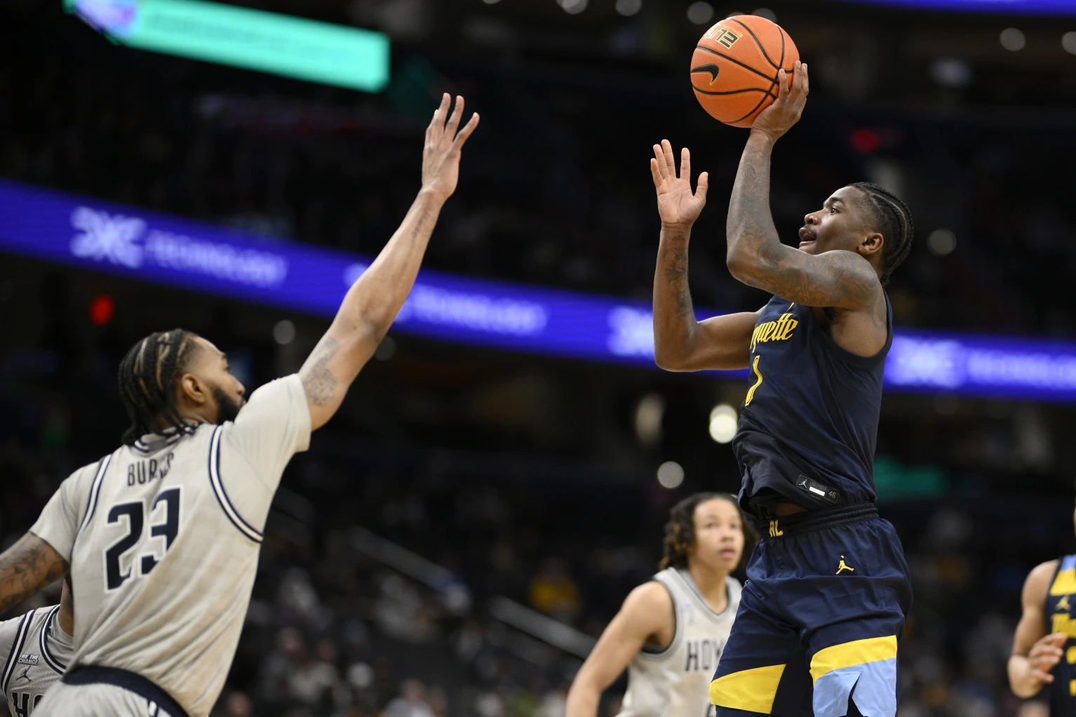 Kam Jones has his fifth double-double to lead No. 21 Marquette past Georgetown 76-61