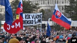 Thousands rally in Slovakia to mark the 2018 slayings of an investigative journalist and his fiancee 
