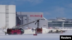 Delta jet flips upside down on a snowy Toronto runway and all 80 aboard survive